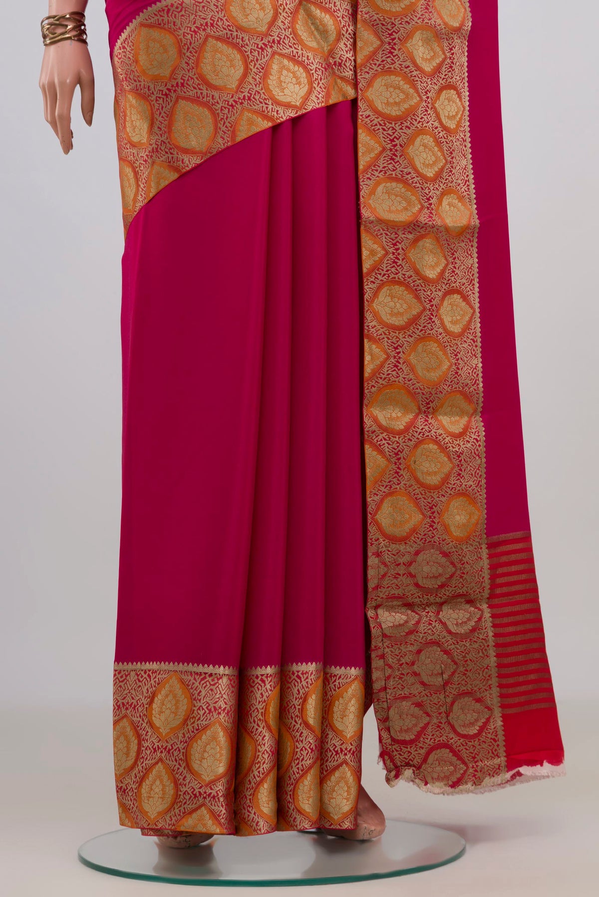 Pleats and pallu of Pink Mysore Crepe Saree with Plain Body and Fancy Border. 