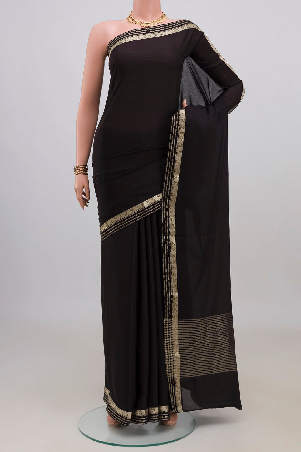 Black Mysore Crepe Saree with Plain Body and Zari Border.  displayed on a mannequin