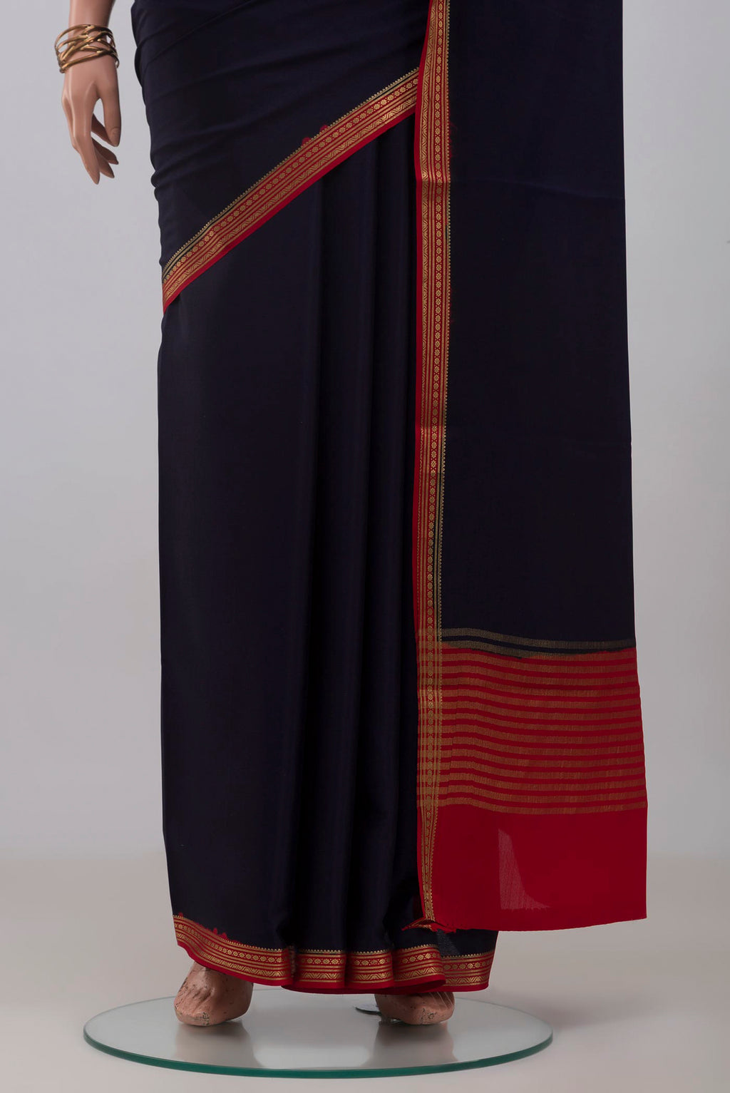 Pleats and pallu of Navy Blue Mysore Crepe Saree with Plain Body and Zari Border. 