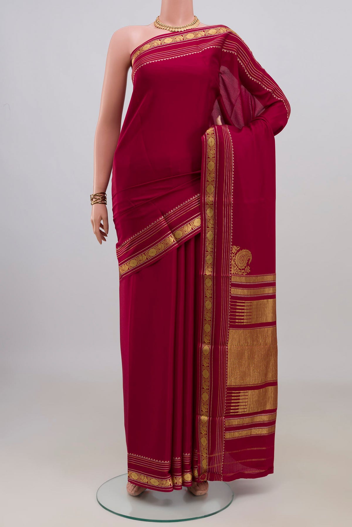 Dark Pink Mysore Crepe Saree with Plain Body and Fancy Border.  displayed on a mannequin