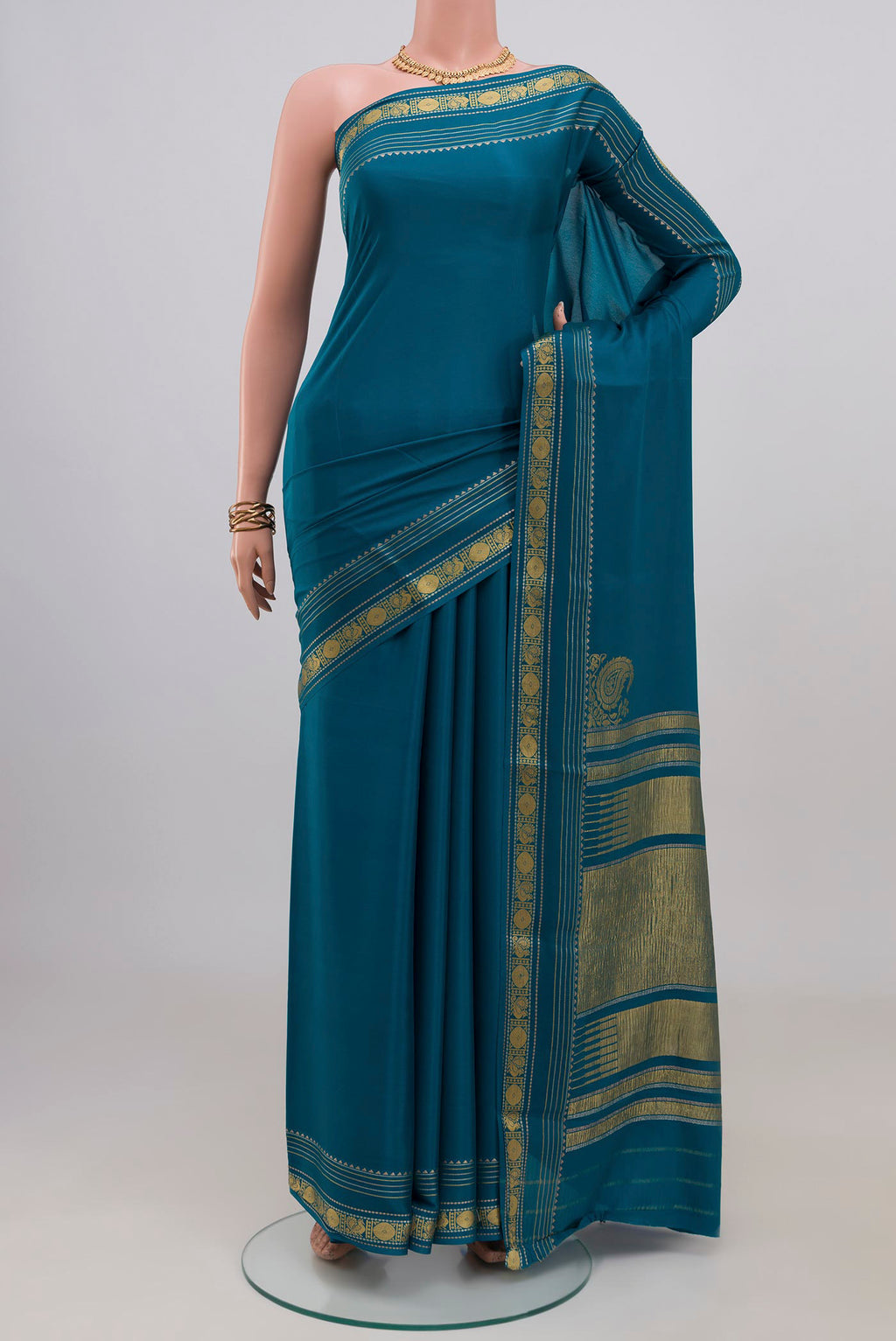 Blue Mysore Crepe Saree with Plain Body and Thin Zari Line.  displayed on a mannequin