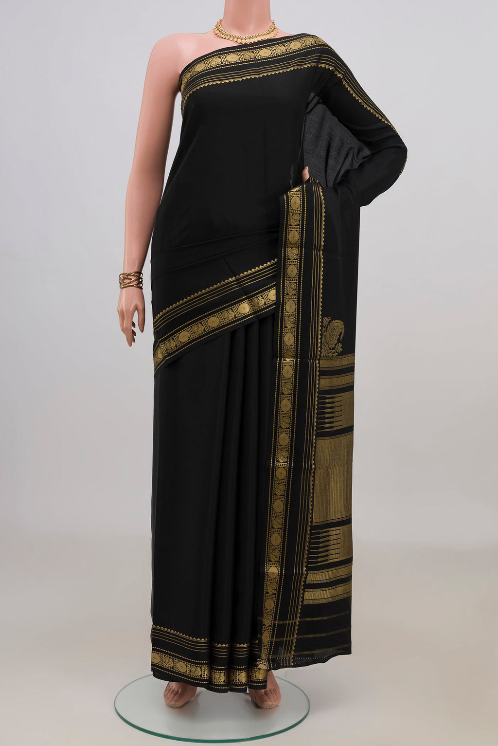 Black Crepe Saree with Plain Body and Zari Border.  displayed on a mannequin
