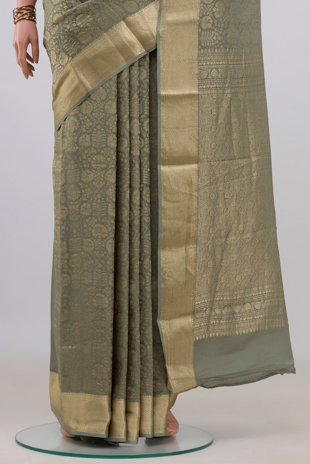 Pleats and pallu of Sage Green Mysore Crepe Saree with Zari Brocade on the body and Zari Border. 