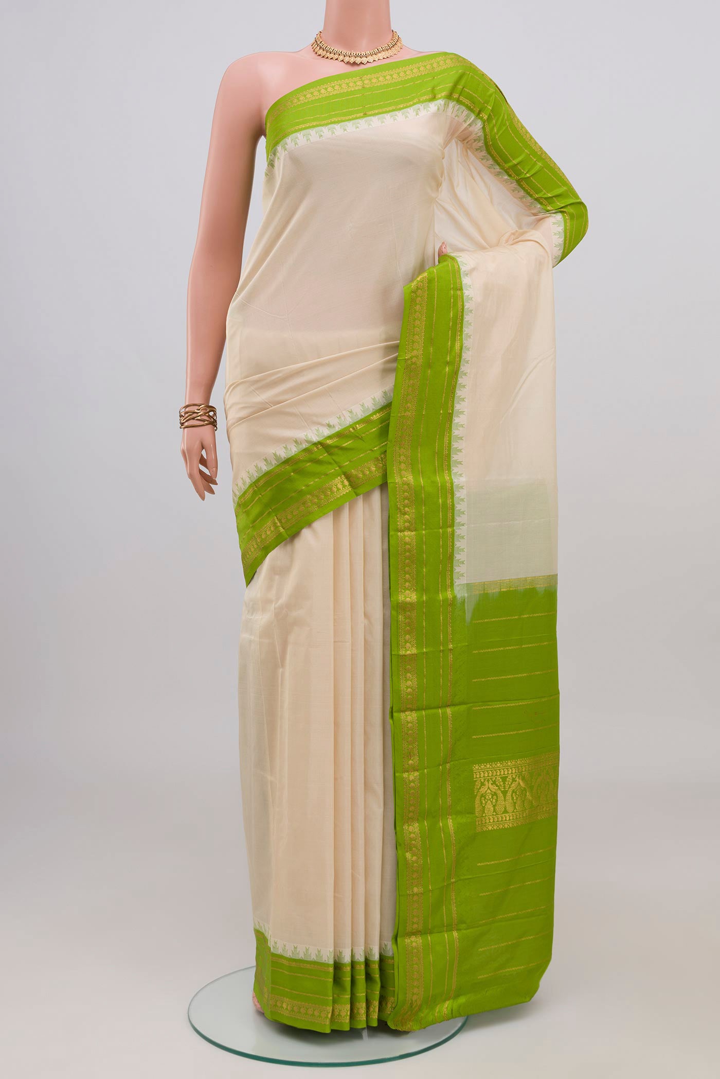 Cream Bangalore Silk Saree with Plain Body and Thin Zari Line.  displayed on a mannequin