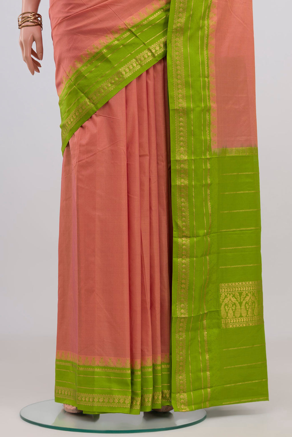 Pleats and pallu of Peach Bangalore Silk Saree with Plain Body and Thin Zari Line. 