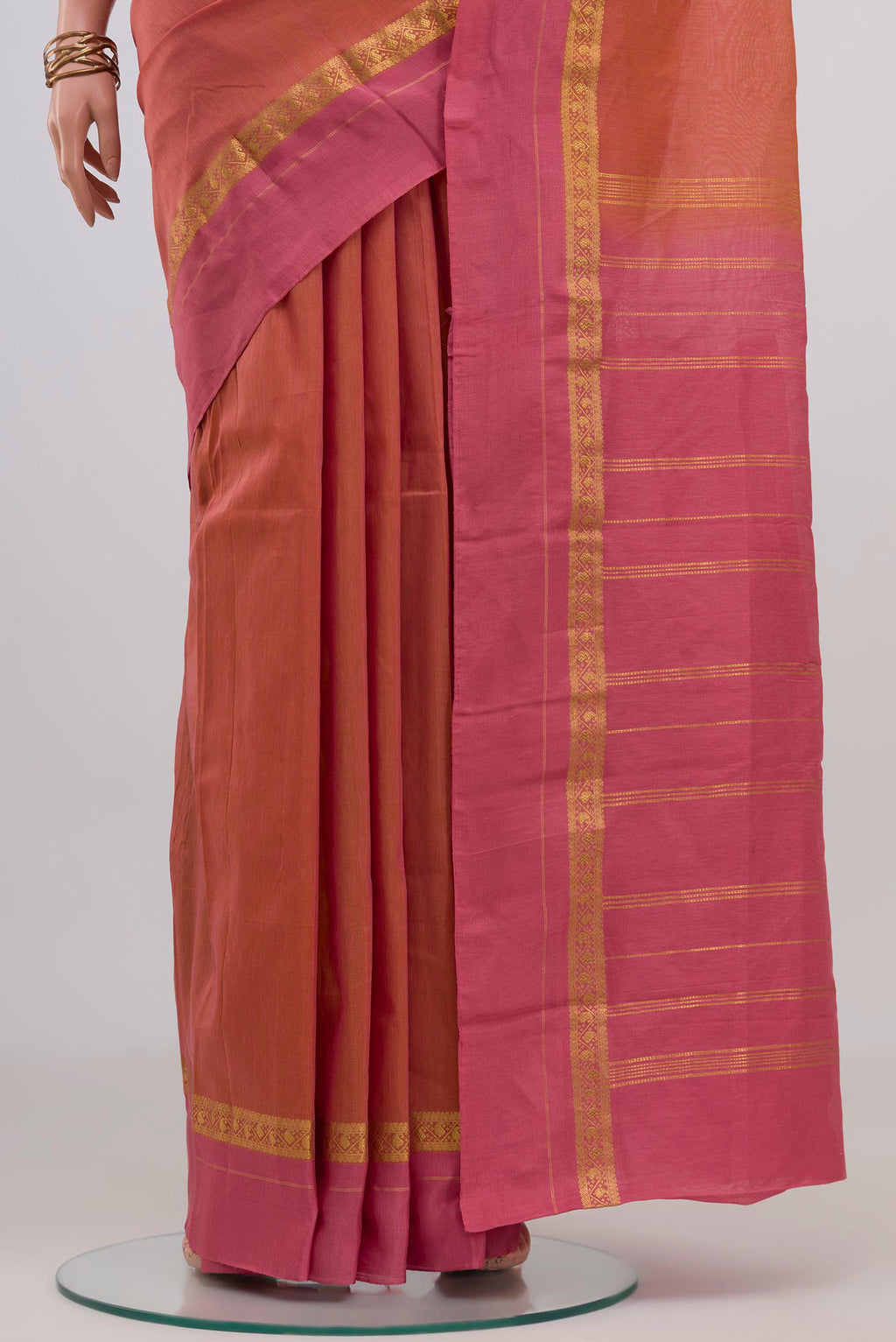 Pleats and pallu of Peach Kanchi Cotton Saree with Plain Body and Thin Zari Line. 