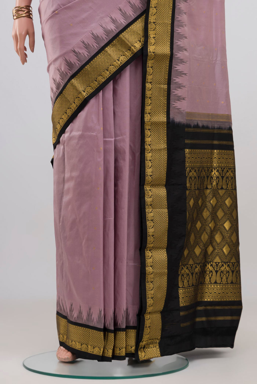 Pleats and pallu of Lavender Bangalore Silk Saree with Zari Butta on the body and Zari Border. 