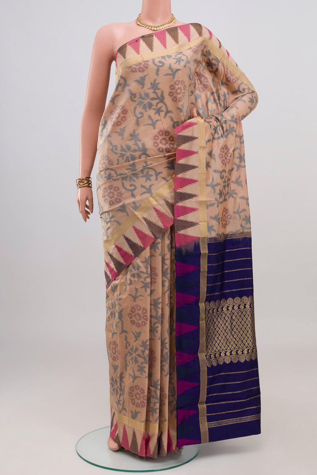 Beige Bangalore Silk Saree with Fancy on the body and Temple Border.  displayed on a mannequin