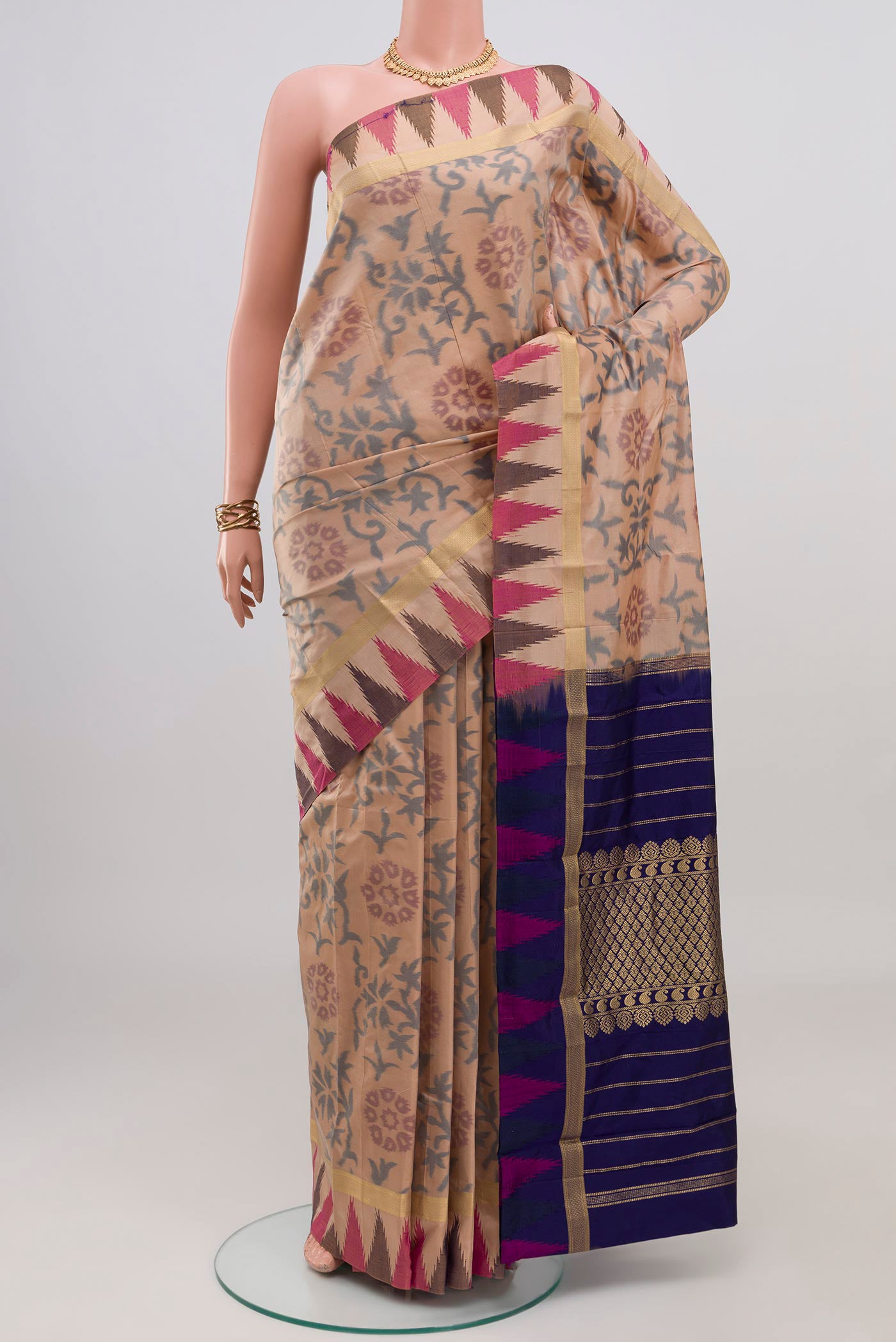 Beige Bangalore Silk Saree with Fancy on the body and Temple Border.  displayed on a mannequin