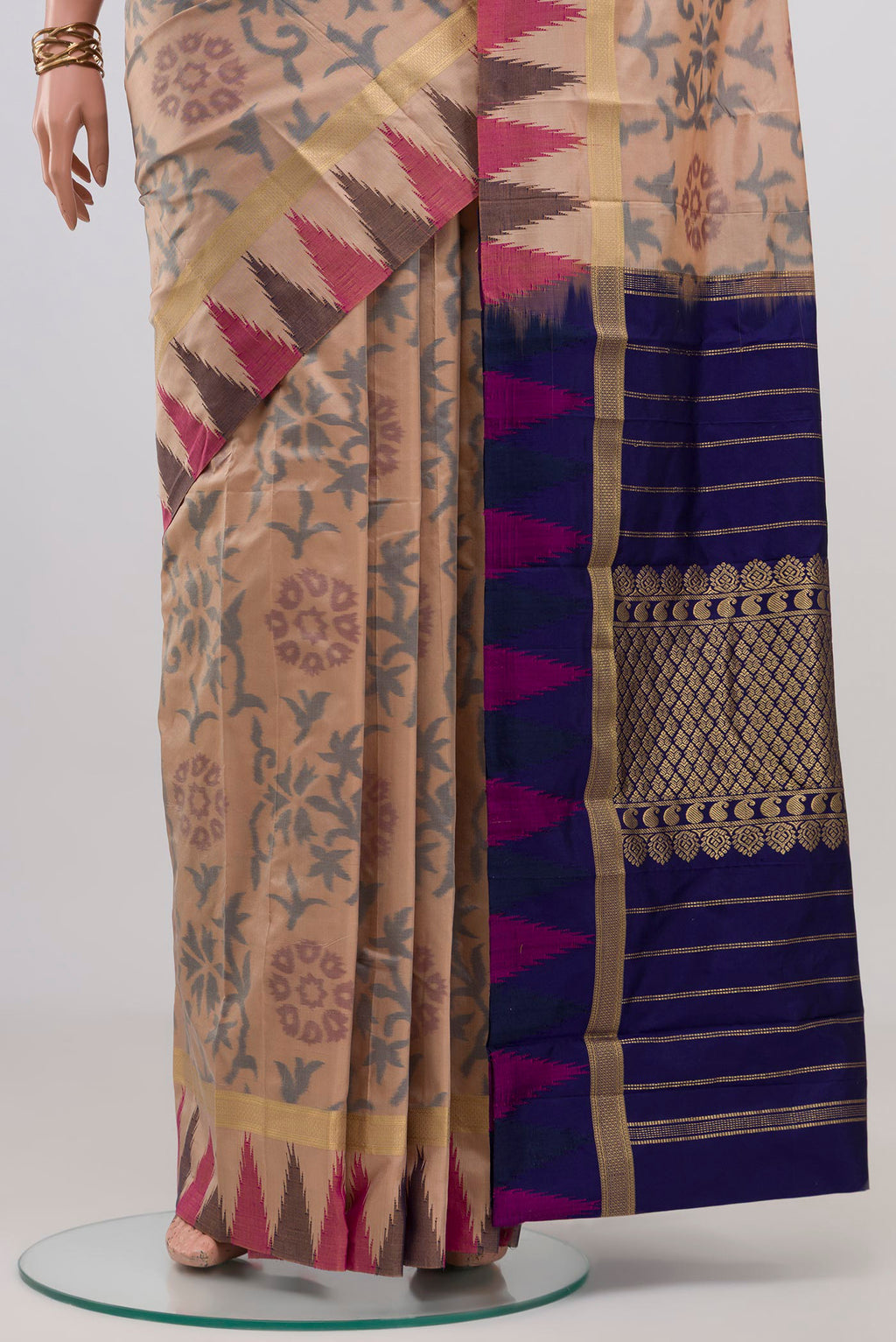 Pleats and pallu of Beige Bangalore Silk Saree with Fancy on the body and Temple Border. 