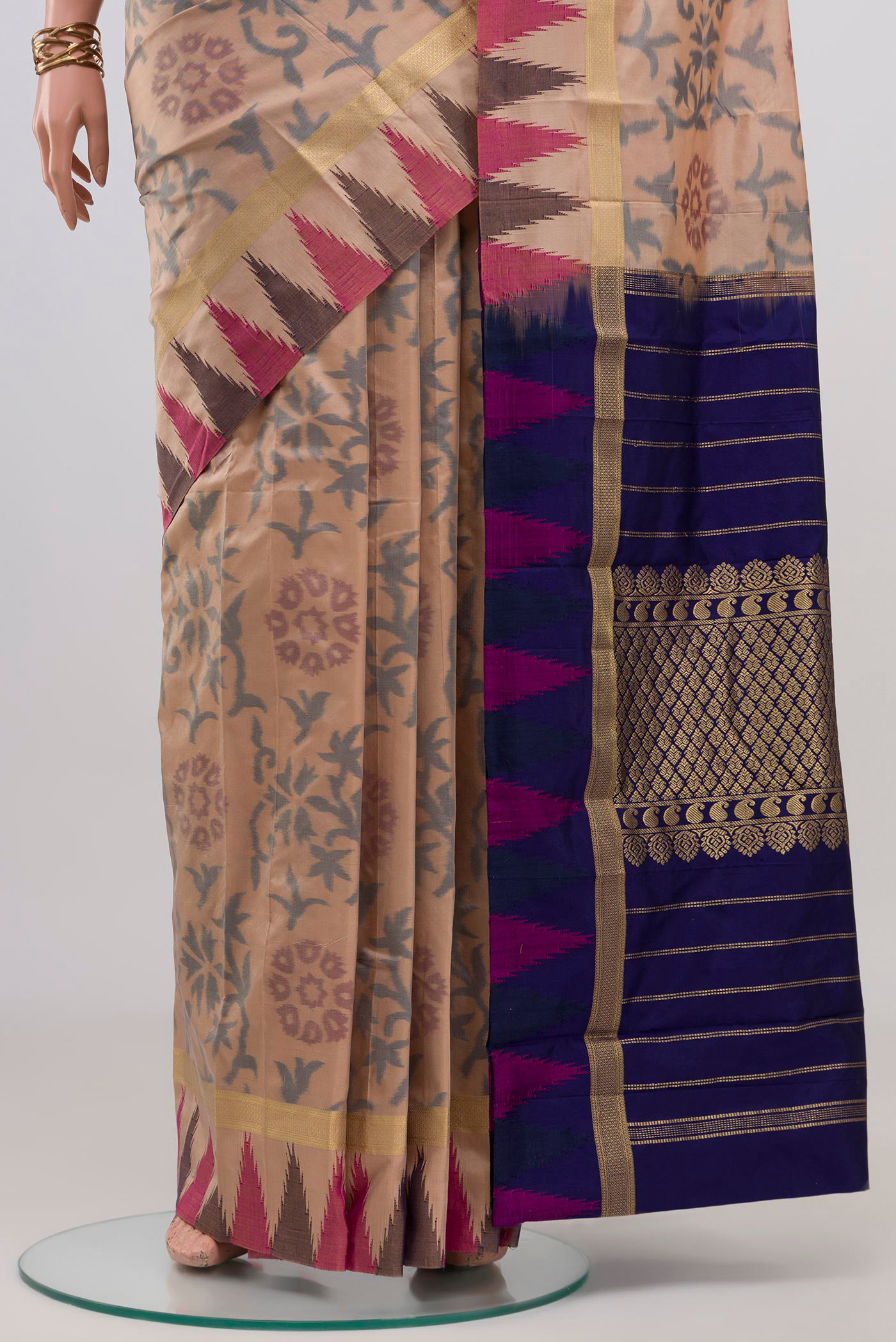 Pleats and pallu of Beige Bangalore Silk Saree with Fancy on the body and Temple Border. 