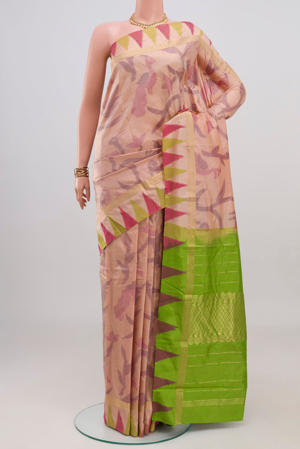 Rose Gold Bangalore Silk Saree with Fancy on the body and Temple Border.  displayed on a mannequin