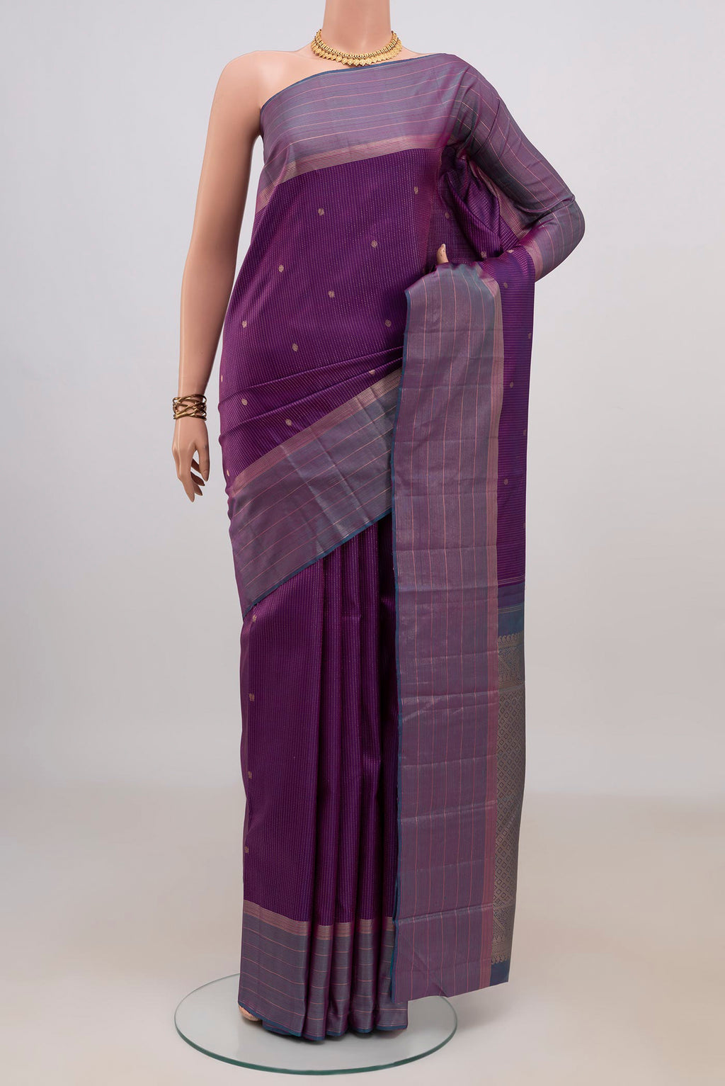 Pure Silk Purple Kanjivaram Saree with Stripes on the body and Zari Border.  displayed on a mannequin