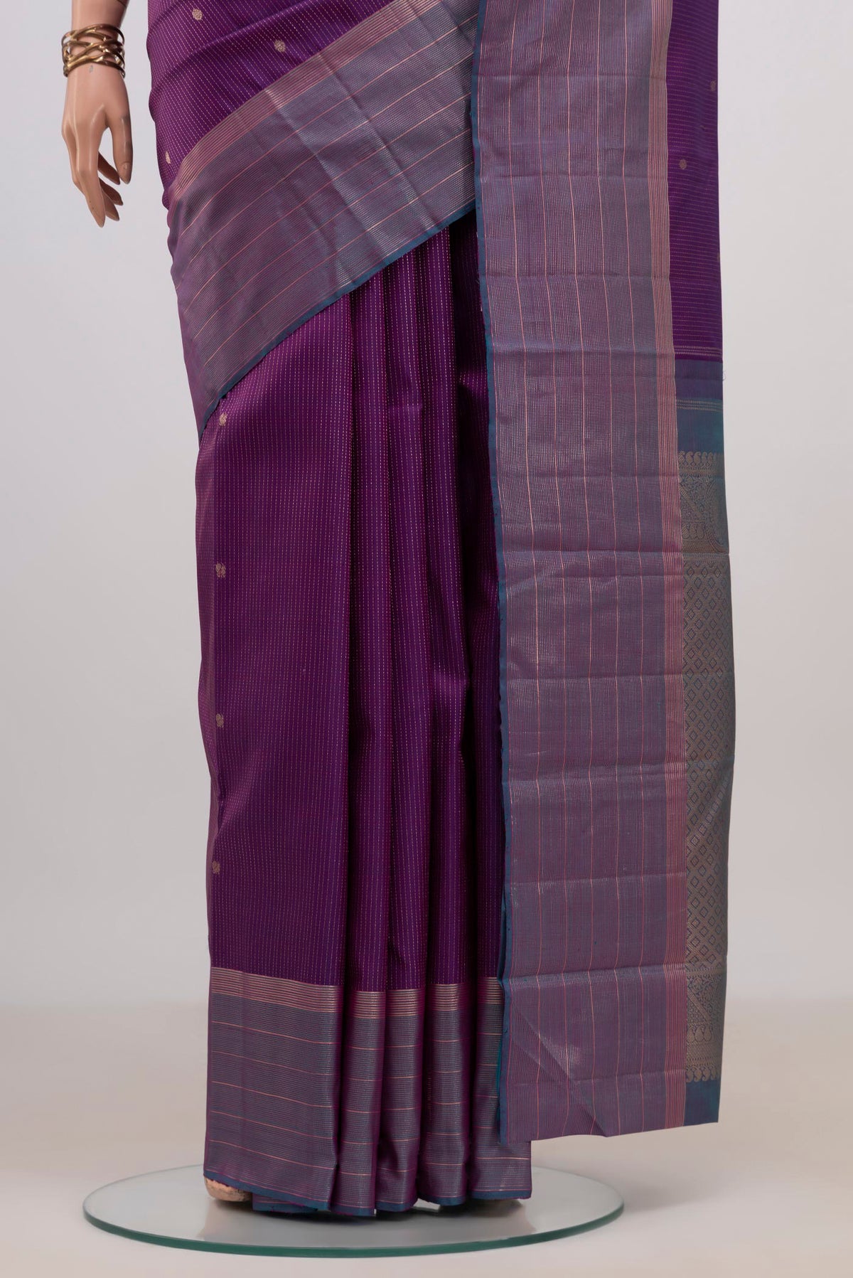 Pleats and pallu of Pure Silk Purple Kanjivaram Saree with Stripes on the body and Zari Border. 