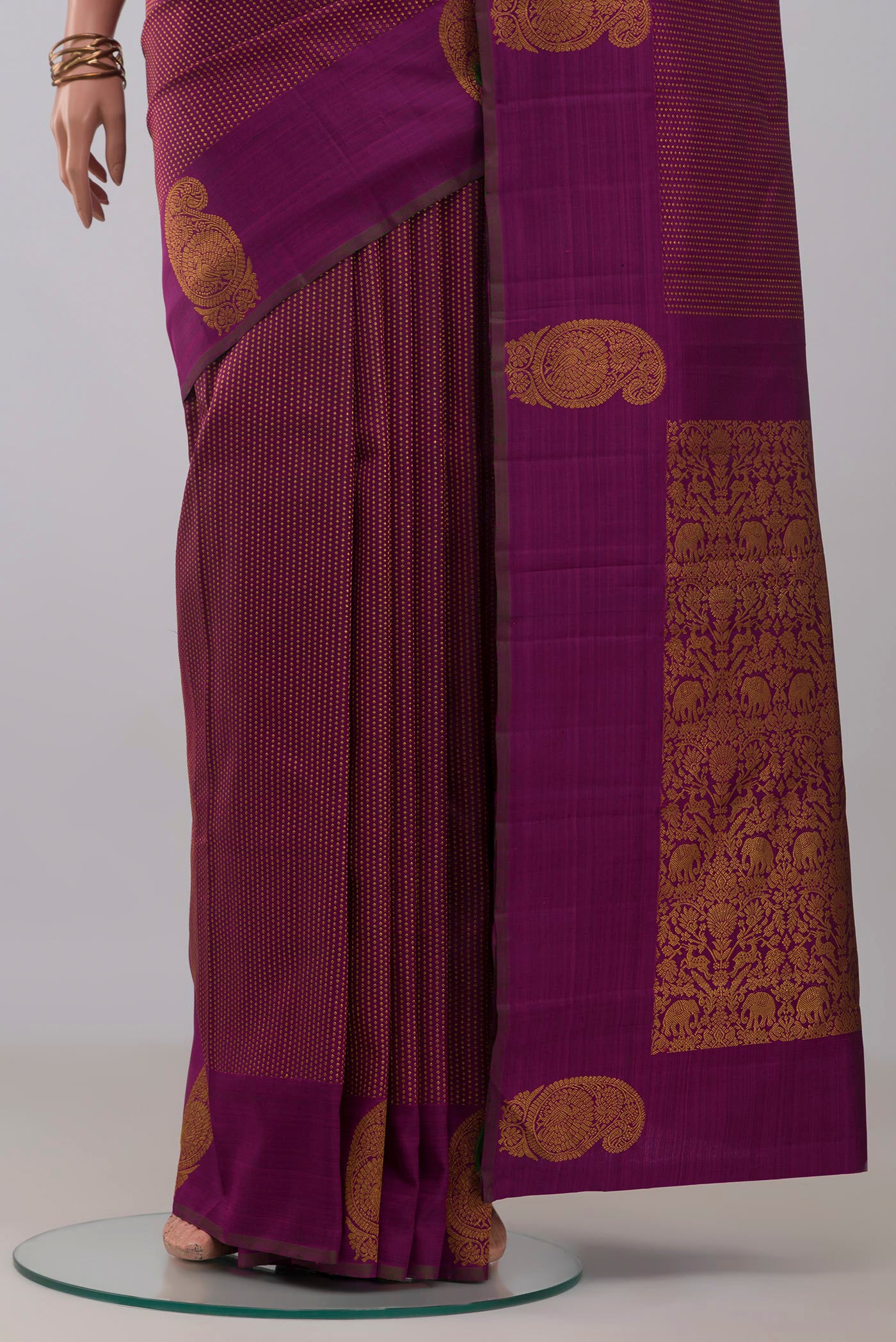Pleats and pallu of Purple Kanjivaram Silk Saree with Stripes on the body and Zari Border. 