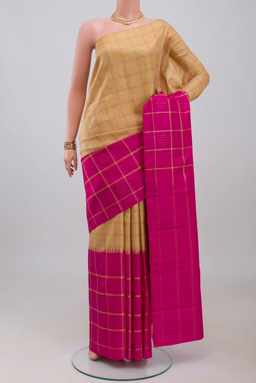 Multi Color Kanchipuram Silk Saree with Checked design on the body and Without Border.  displayed on a mannequin