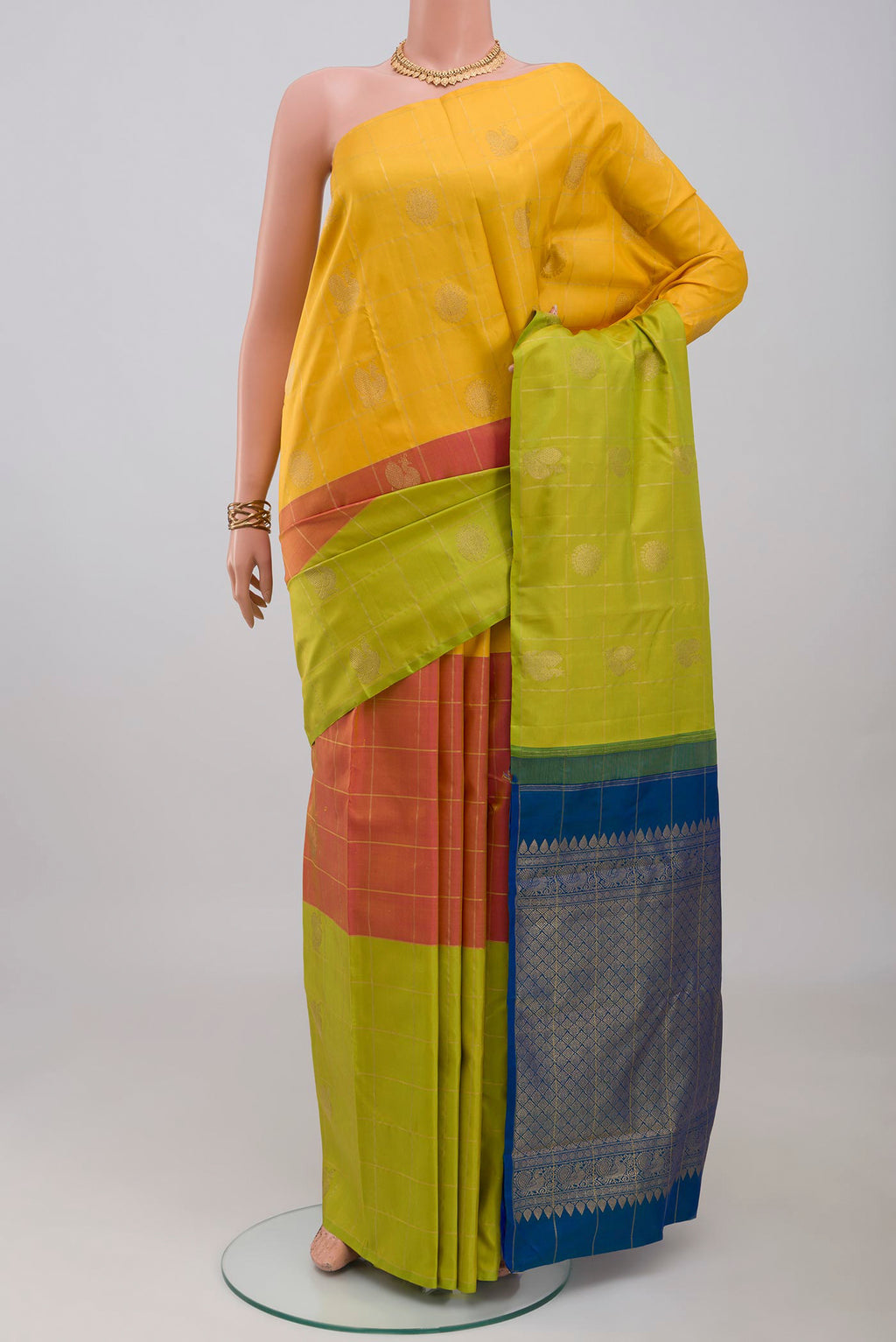 Multi Color Kanjivaram Silk Saree with Checked design on the body and Without Border.  displayed on a mannequin