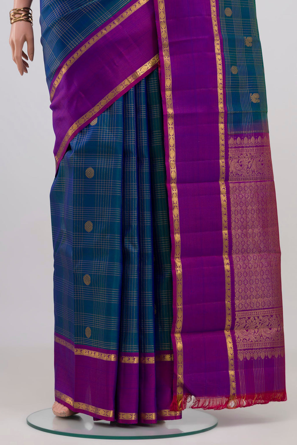 Pleats and pallu of Peacock Blue Kanjivaram Silk Saree with Checked design on the body and Plain Border. 