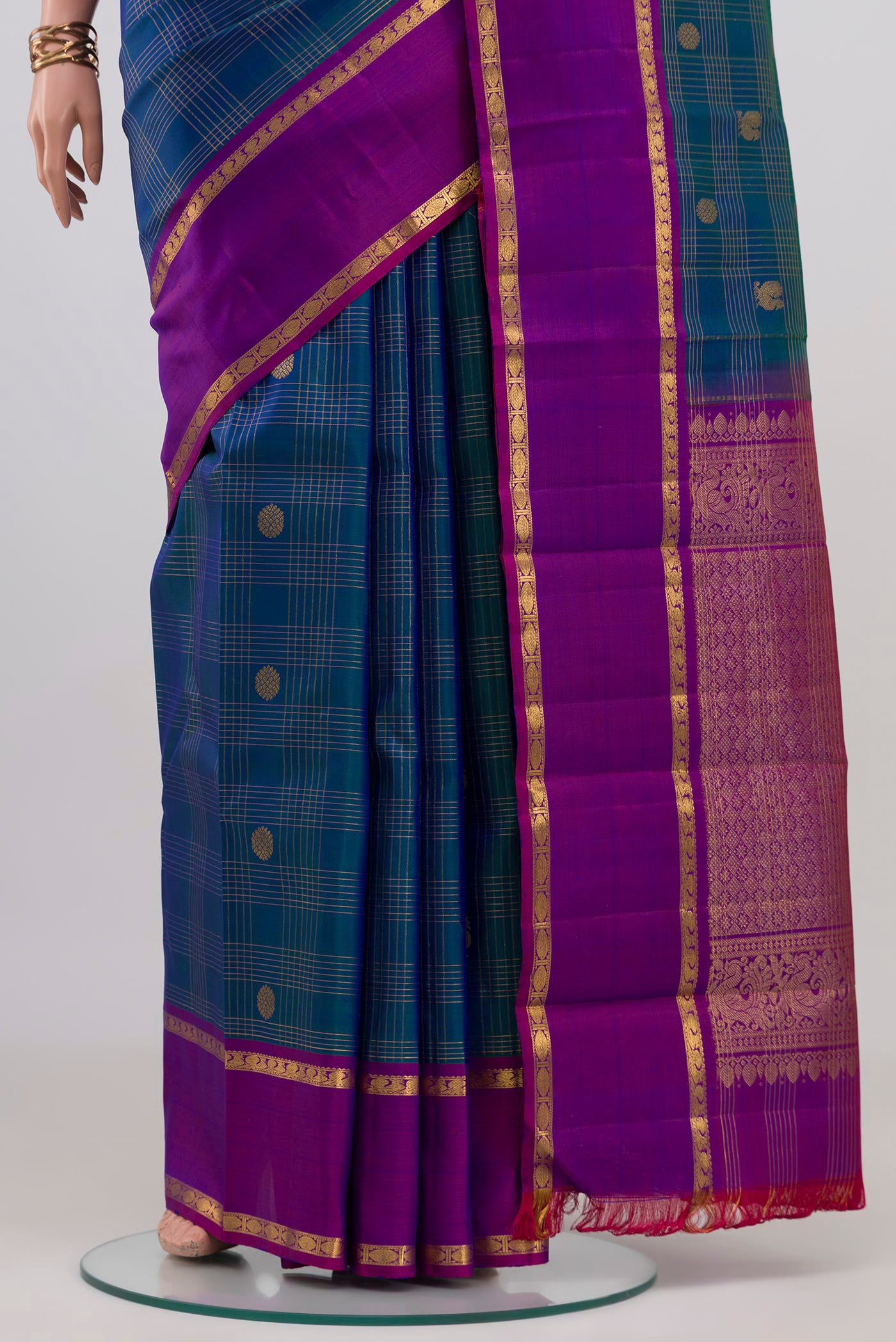 Pleats and pallu of Peacock Blue Kanjivaram Silk Saree with Checked design on the body and Plain Border. 