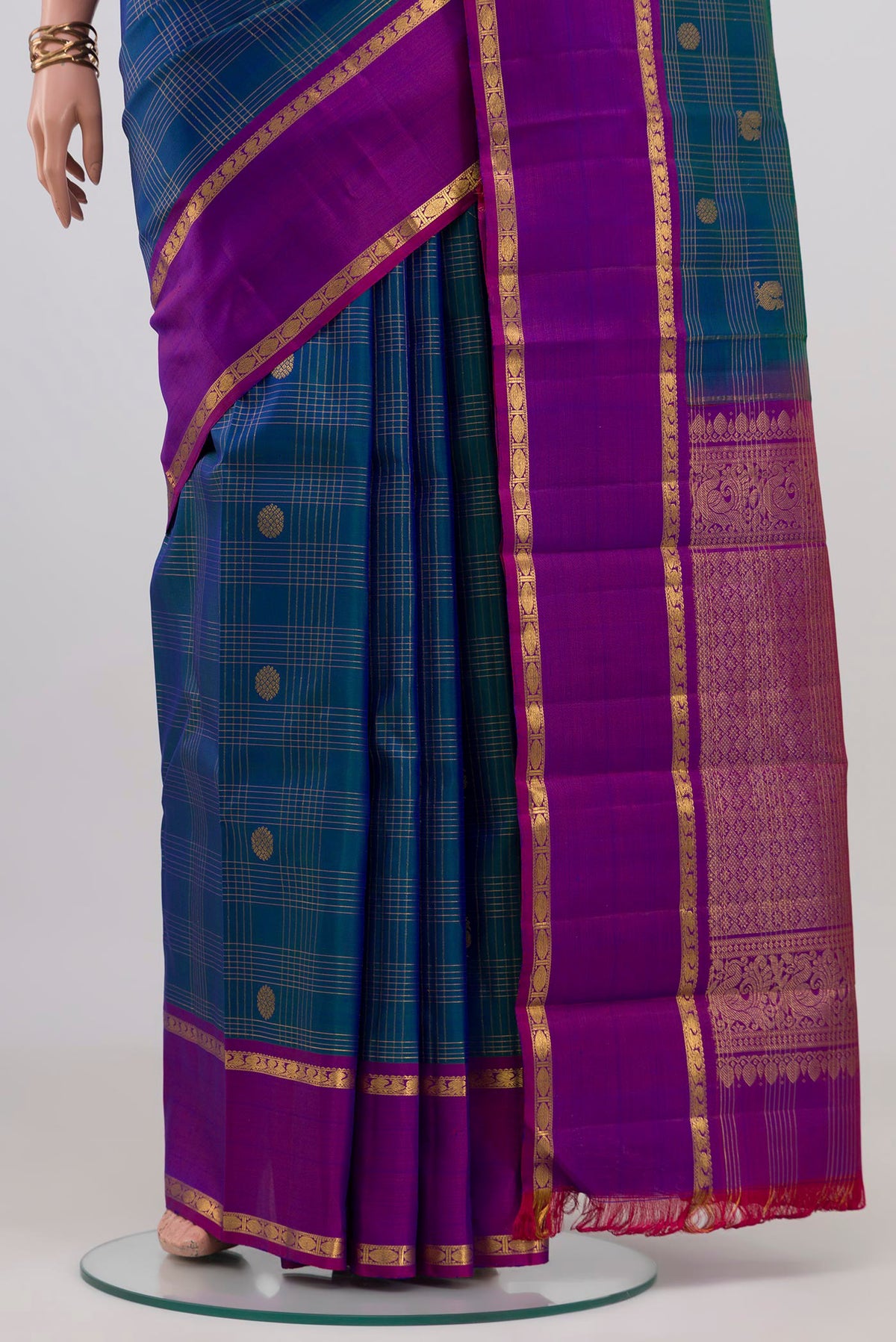 Pleats and pallu of Peacock Blue Kanjivaram Silk Saree with Checked design on the body and Plain Border. 