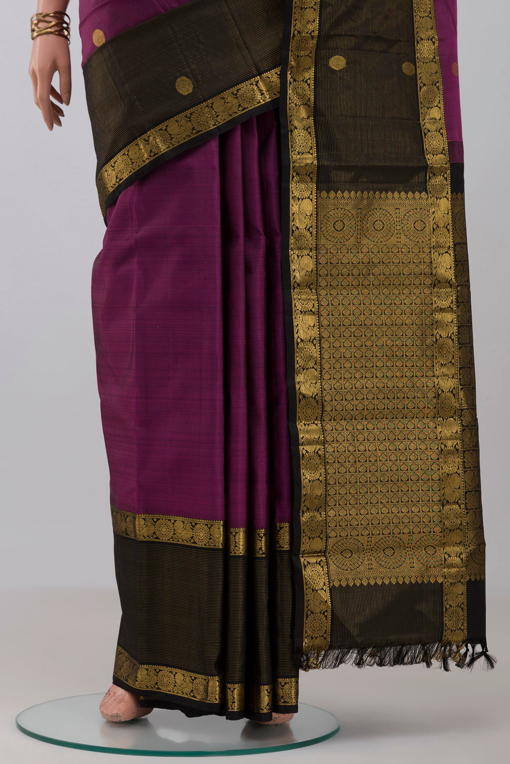 Pleats and pallu of Purple Kanjivaram Silk Saree with Zari Butta on the body and Zari Border. 