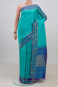 Pure Silk Turquoise Kanchipuram Saree with Plain Body and Fancy Border.  displayed on a mannequin