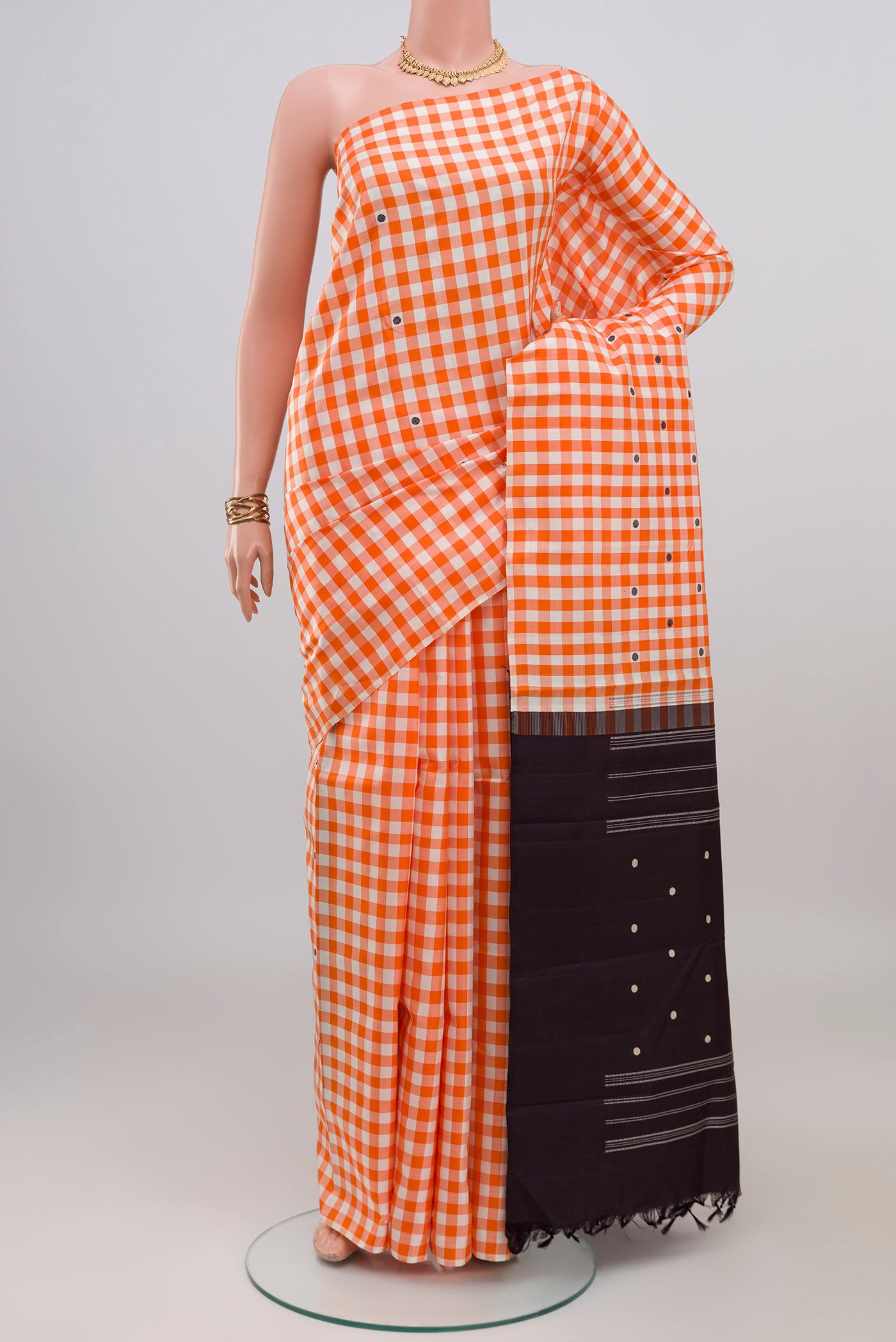 Multi Color Kanjivaram Silk Saree with Checked design on the body and Without Border.  displayed on a mannequin