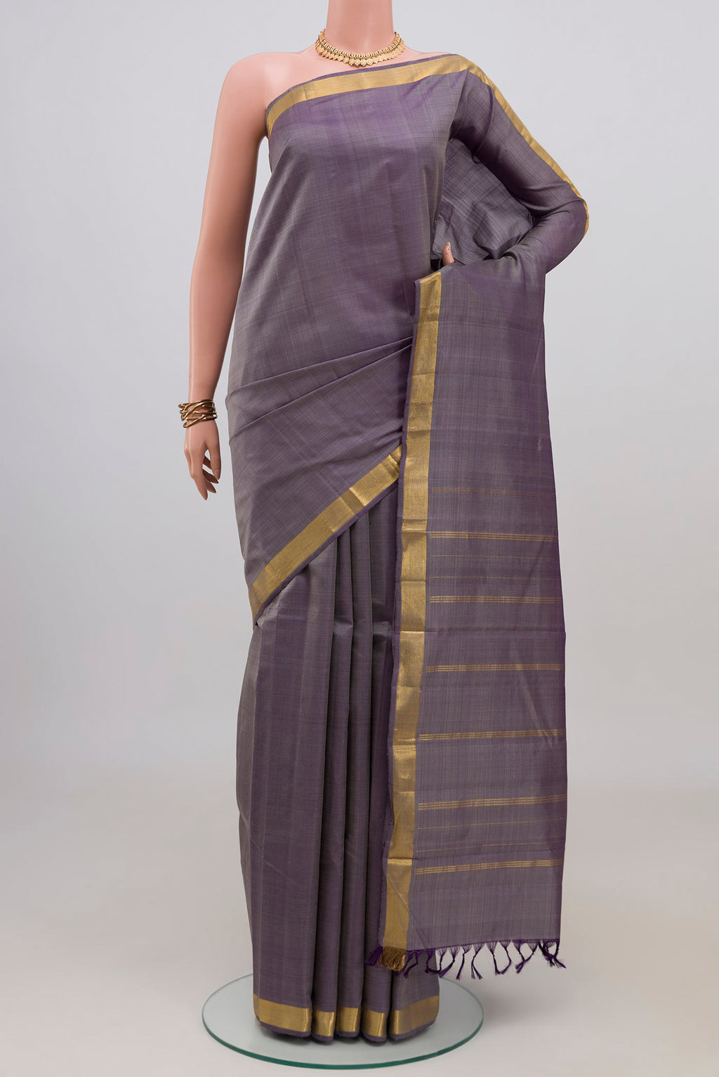 Blue Grey Kanchipuram Silk Saree with Plain Body and Zari Border.  displayed on a mannequin