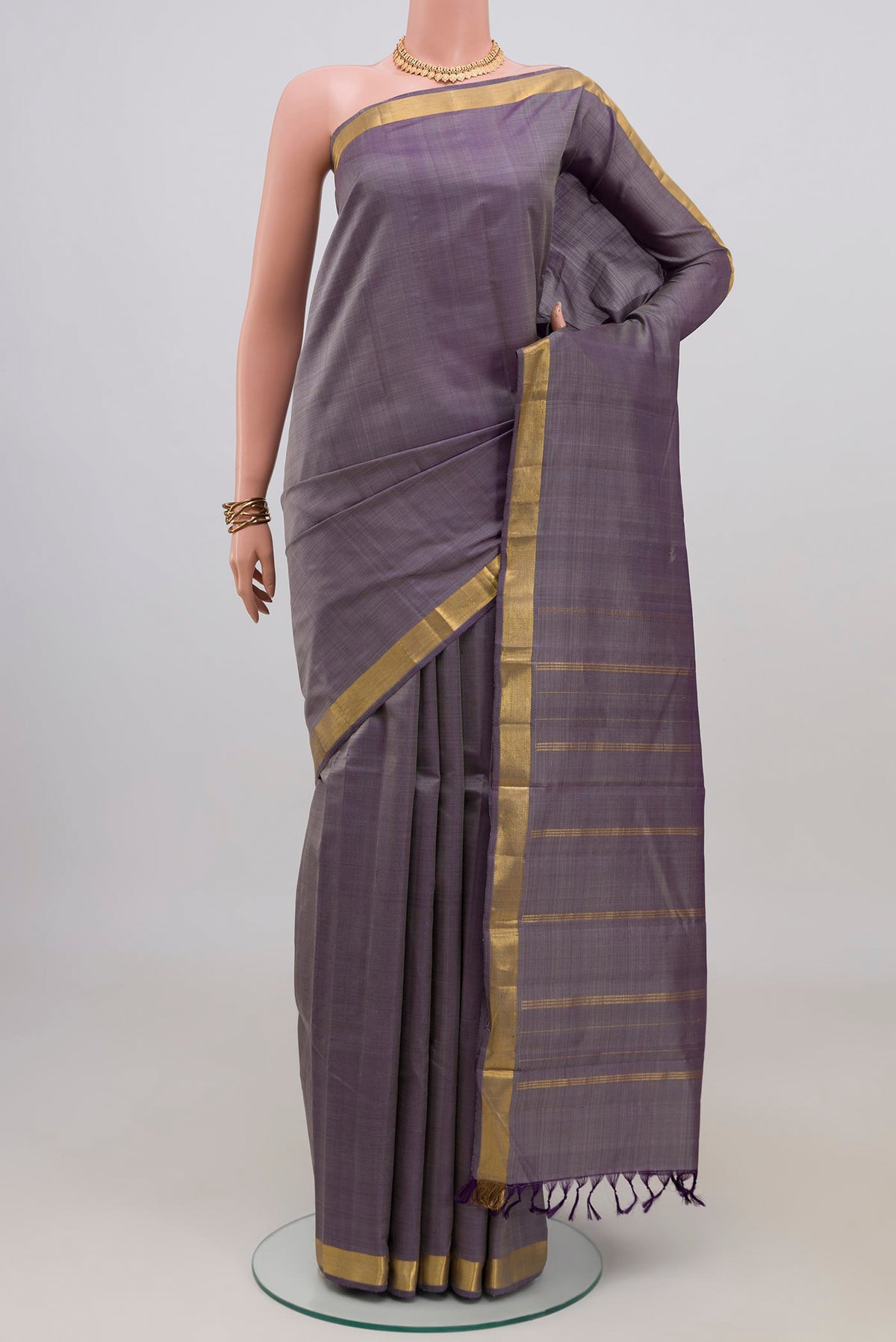 Blue Grey Kanchipuram Silk Saree with Plain Body and Zari Border.  displayed on a mannequin