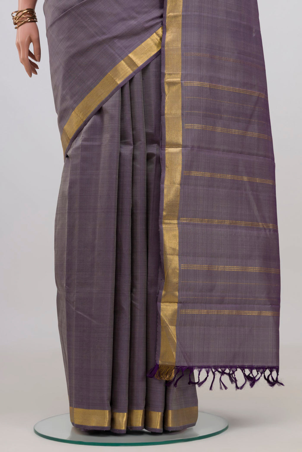 Pleats and pallu of Blue Grey Kanchipuram Silk Saree with Plain Body and Zari Border. 
