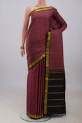 Mauve Kanchipuram Silk Saree with Plain Body and Zari Border.  displayed on a mannequin