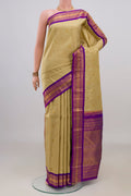 Pure Silk Pure Zari Sandal Kanchipuram Saree with Zari Butta on the body and Zari Border.  displayed on a mannequin