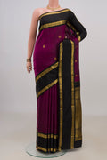Pure Silk Magenta Kanchipuram Saree with Zari Butta on the body and Zari Border.  displayed on a mannequin