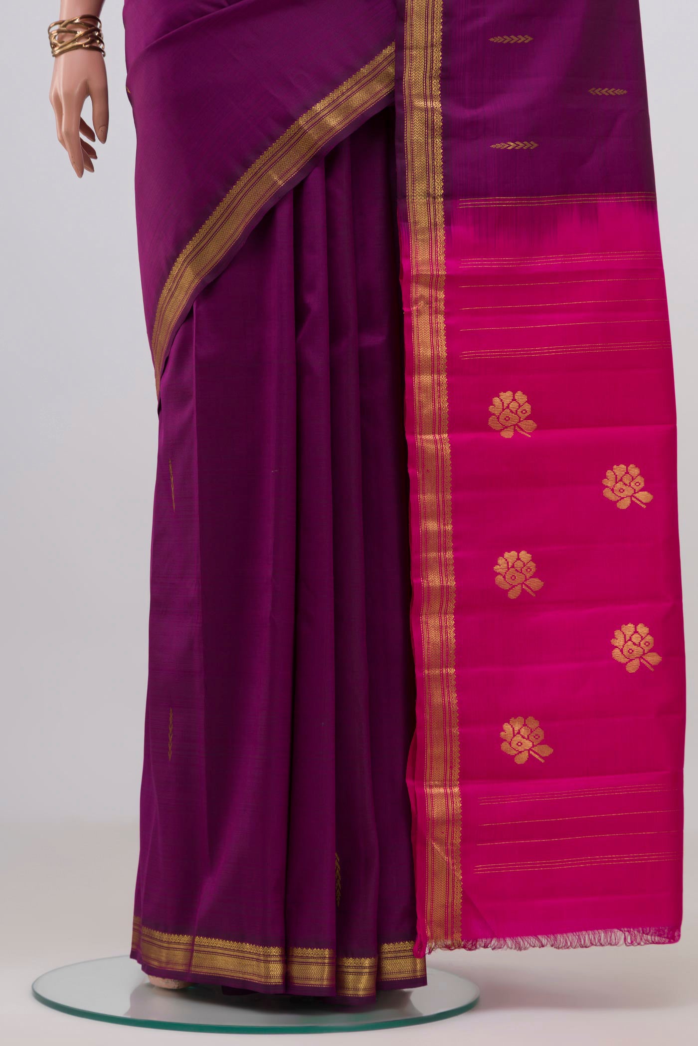 Pleats and pallu of Purple Kanchipuram Silk Saree with Zari Butta on the body and Zari Border. 