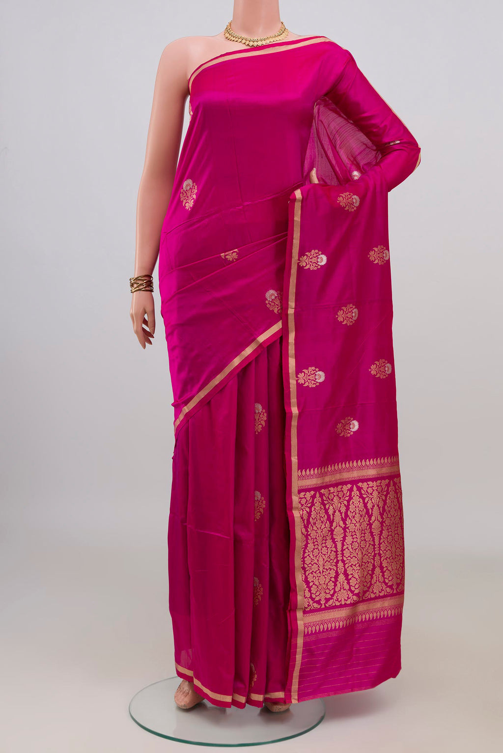 Pure Silk Pink Banarasi Katan Saree with Zari Butta on the body and Thin Zari Line.  displayed on a mannequin