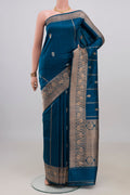 Pure Silk Blue Banarasi Katan Saree with Zari Butta on the body and Zari Border.  displayed on a mannequin