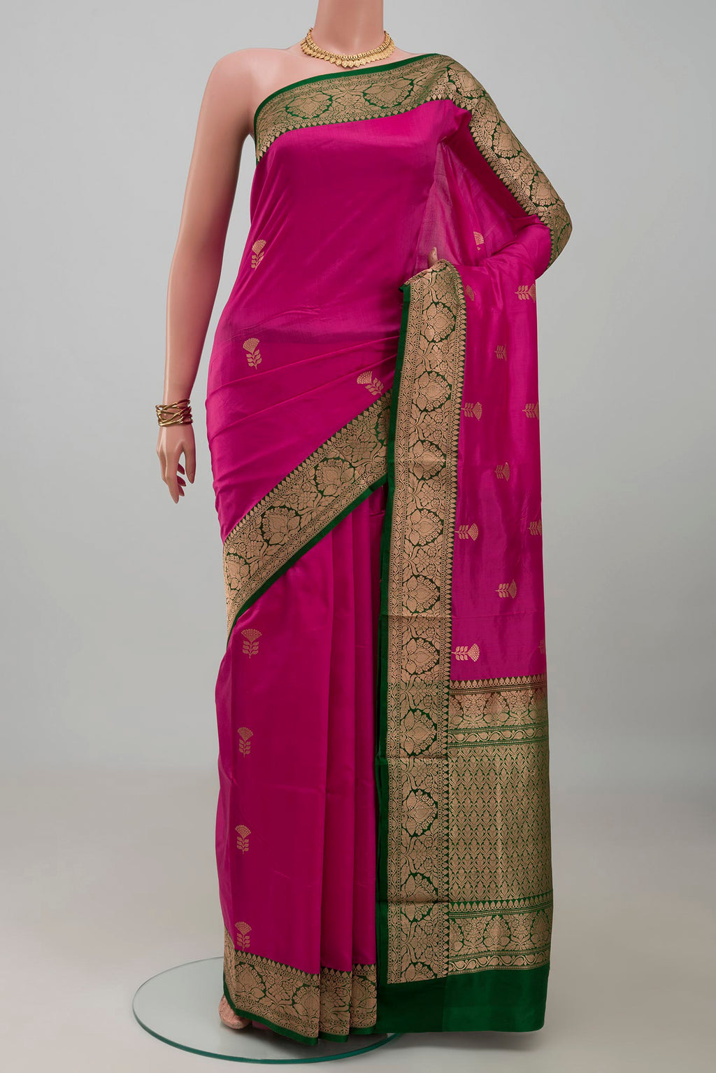 Pink Banarasi Katan Silk Saree with Zari Butta on the body and Zari Border.  displayed on a mannequin