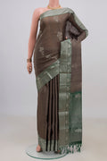 Pure Silk Grey Soft Saree with Zari Butta on the body and Zari Border.  displayed on a mannequin