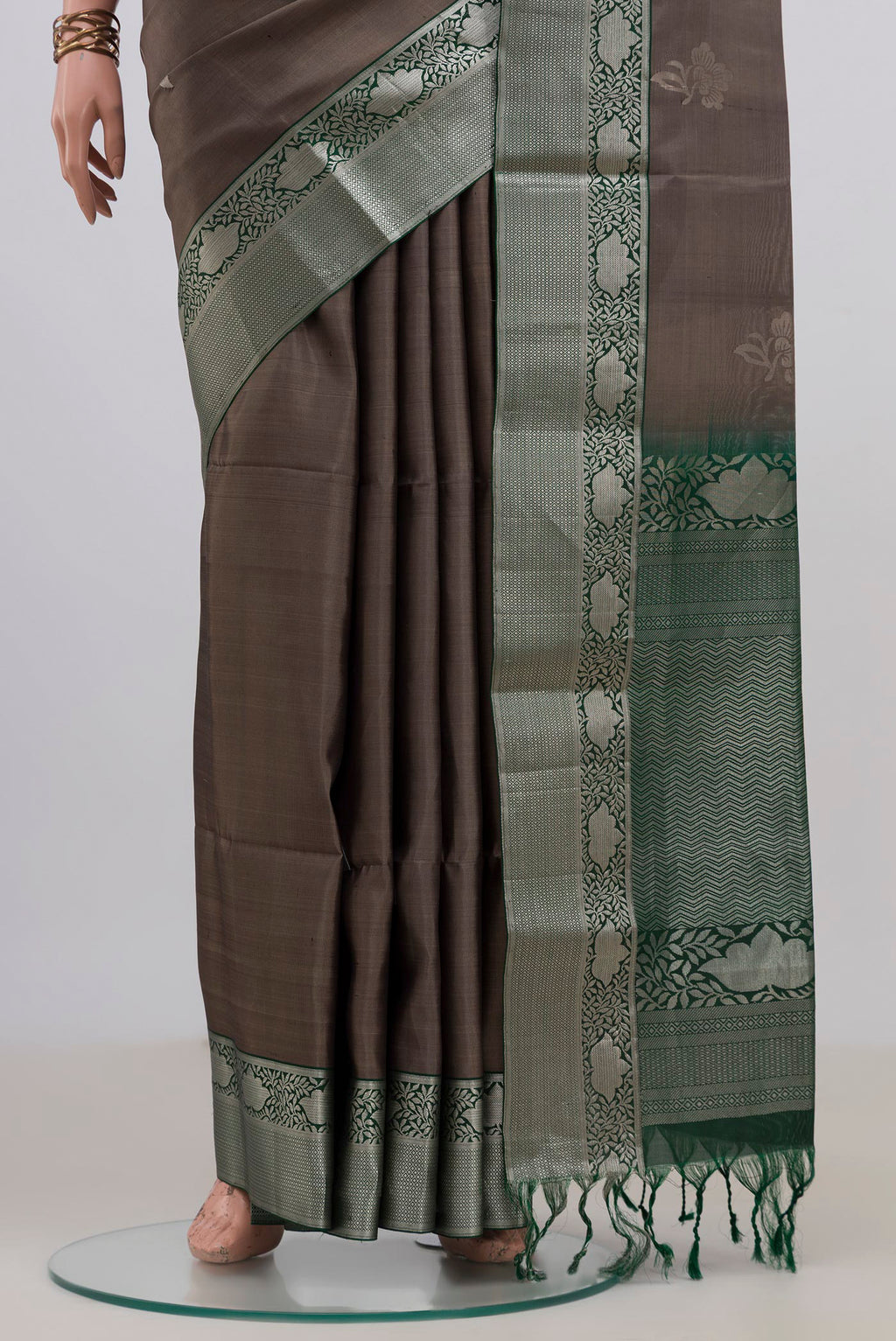 Pleats and pallu of Pure Silk Grey Soft Saree with Zari Butta on the body and Zari Border. 