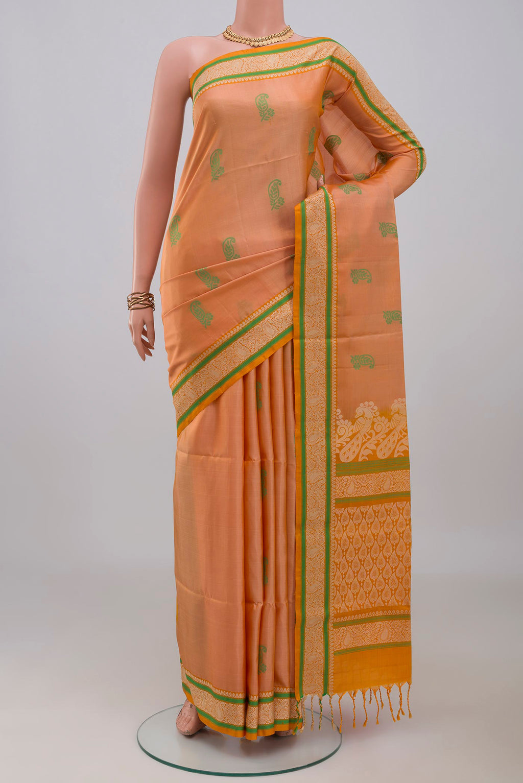 Peach Soft Silk Saree with Thread Butta on the body and Thread Border.  displayed on a mannequin