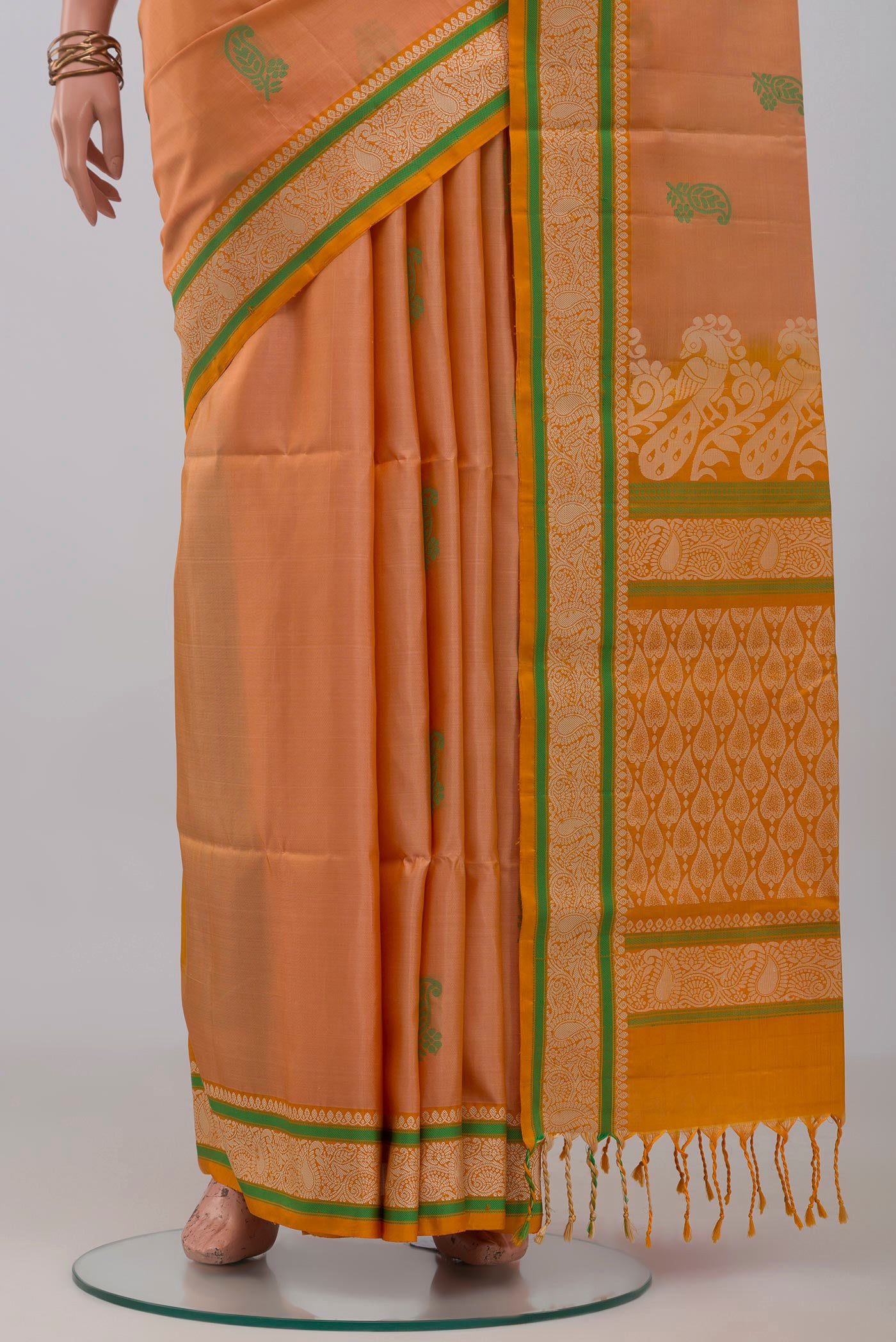 Pleats and pallu of Peach Soft Silk Saree with Thread Butta on the body and Thread Border. 