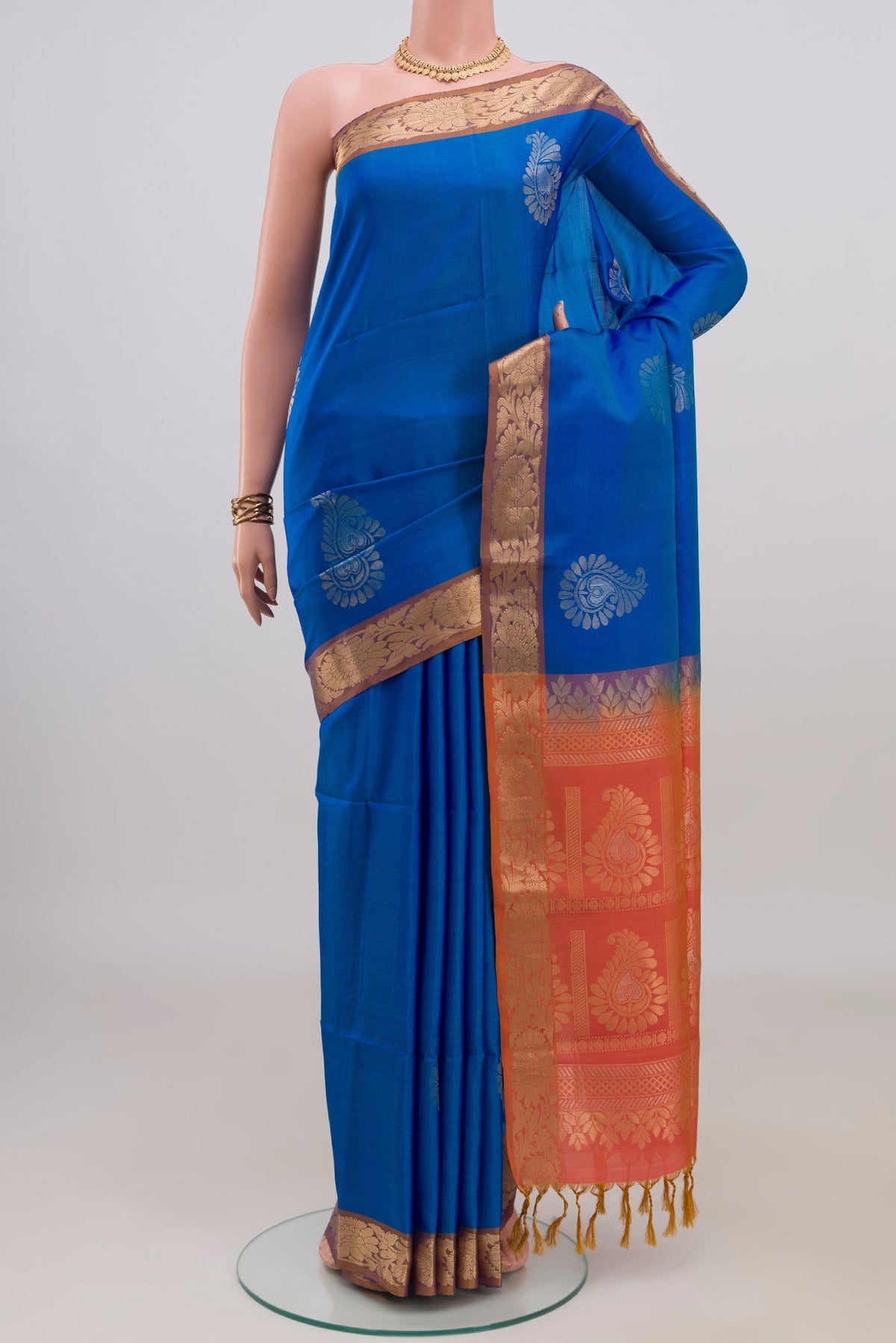 Pure Silk Blue Soft Saree with Zari Butta on the body and Zari Border.  displayed on a mannequin