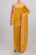 Pure Silk Yellow Banarasi Saree with Jacquard With Zari Butta on the body and Zari Border.  displayed on a mannequin