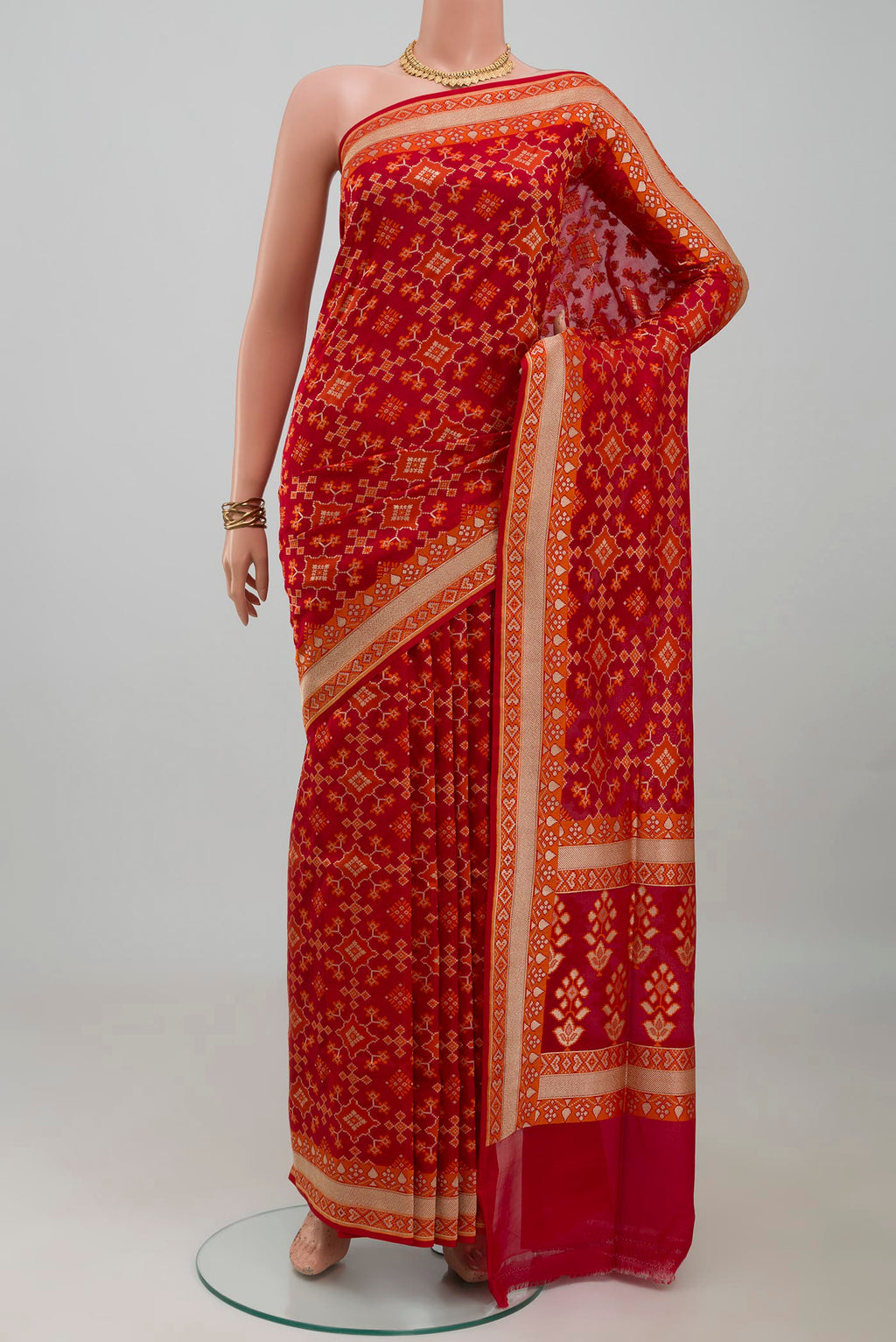 Red Banarasi Silk Saree with Zari And Thread Butta on the body and Zari Border.  displayed on a mannequin
