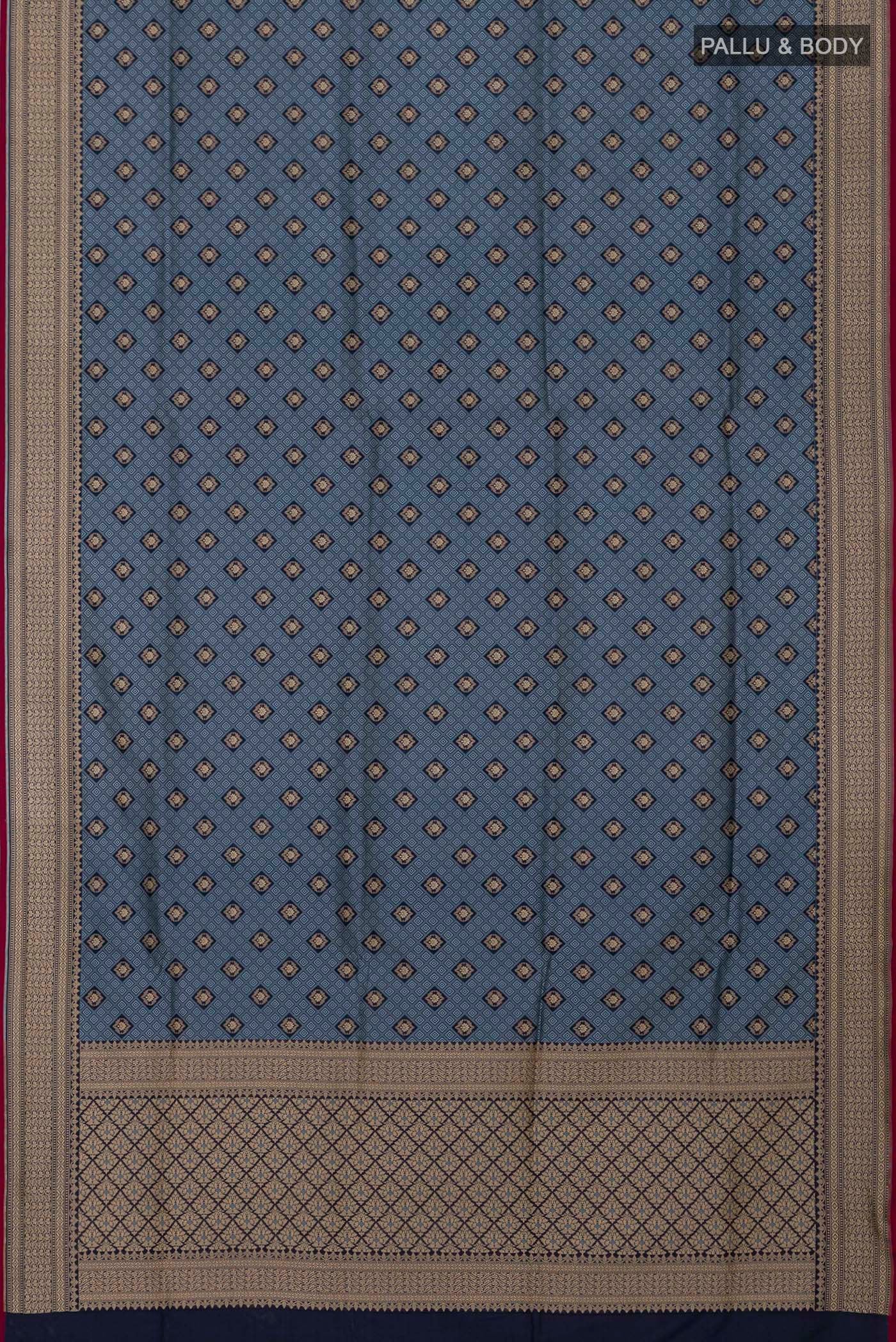 Flat view of Grey Banarasi Silk Saree with Jacquard With Zari Butta on the body and Zari Border. 