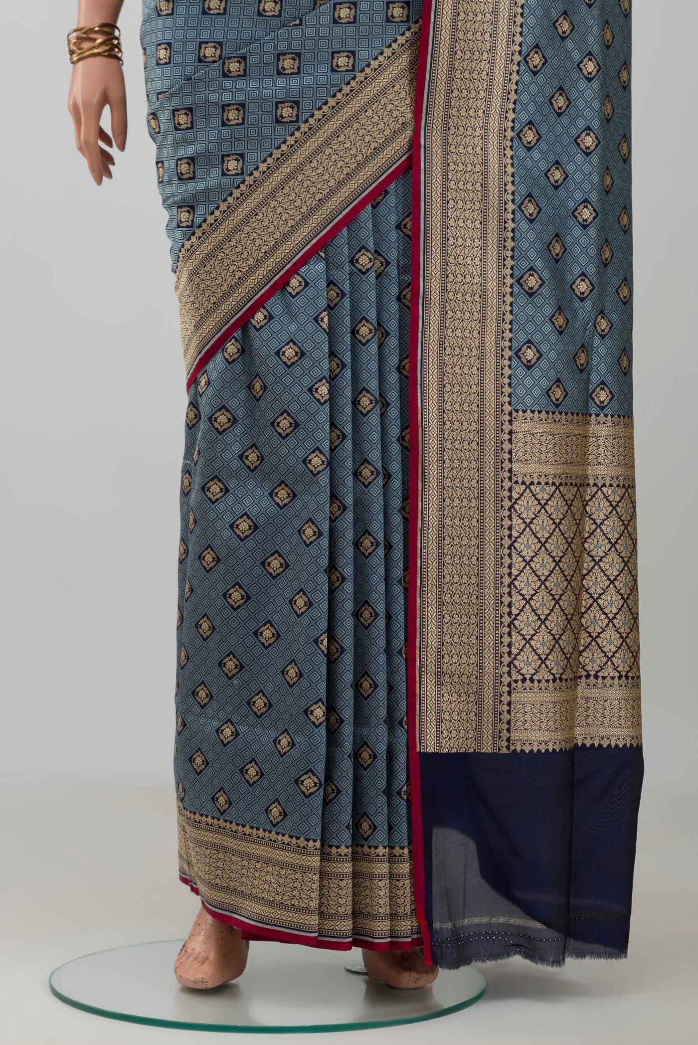 Pleats and pallu of Grey Banarasi Silk Saree with Jacquard With Zari Butta on the body and Zari Border. 