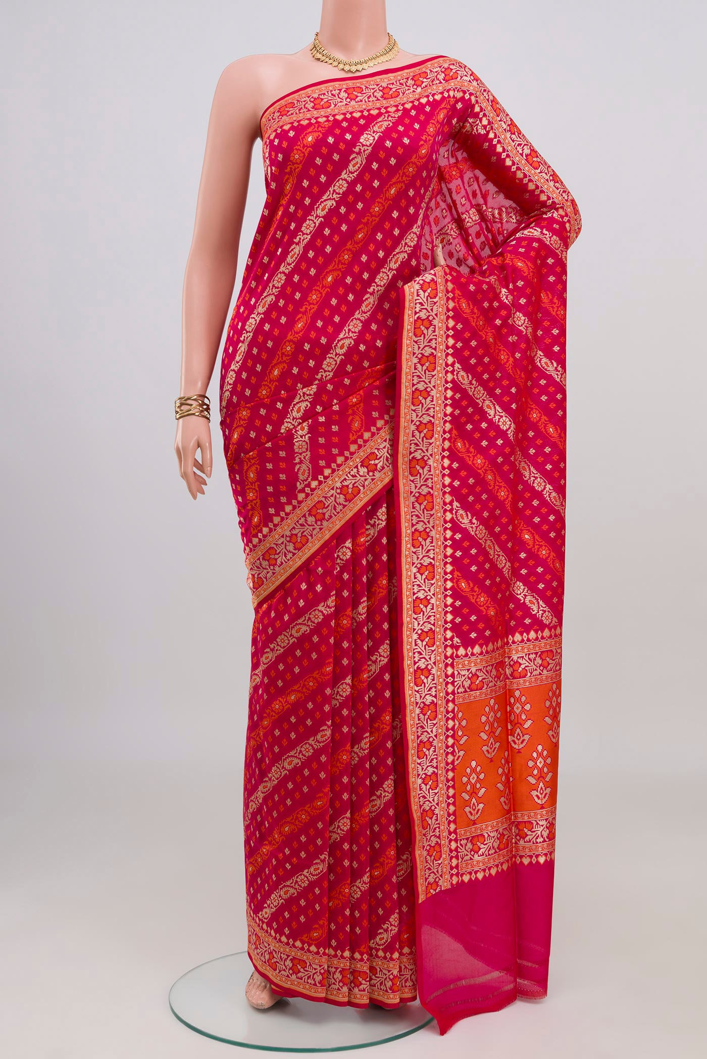 Pink Banarasi Silk Saree with Zari And Thread Butta on the body and Zari Border.  displayed on a mannequin