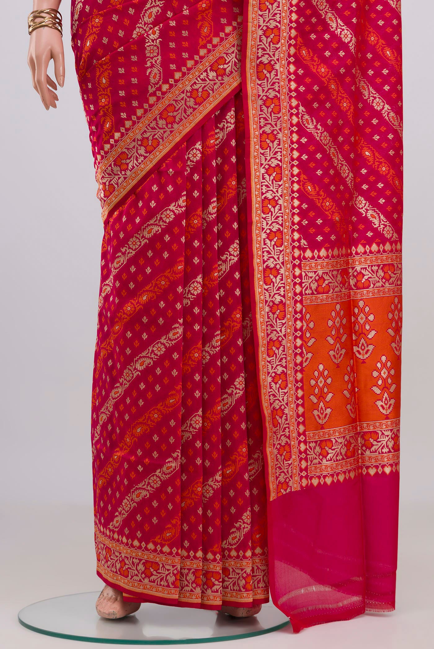 Pleats and pallu of Pink Banarasi Silk Saree with Zari And Thread Butta on the body and Zari Border. 