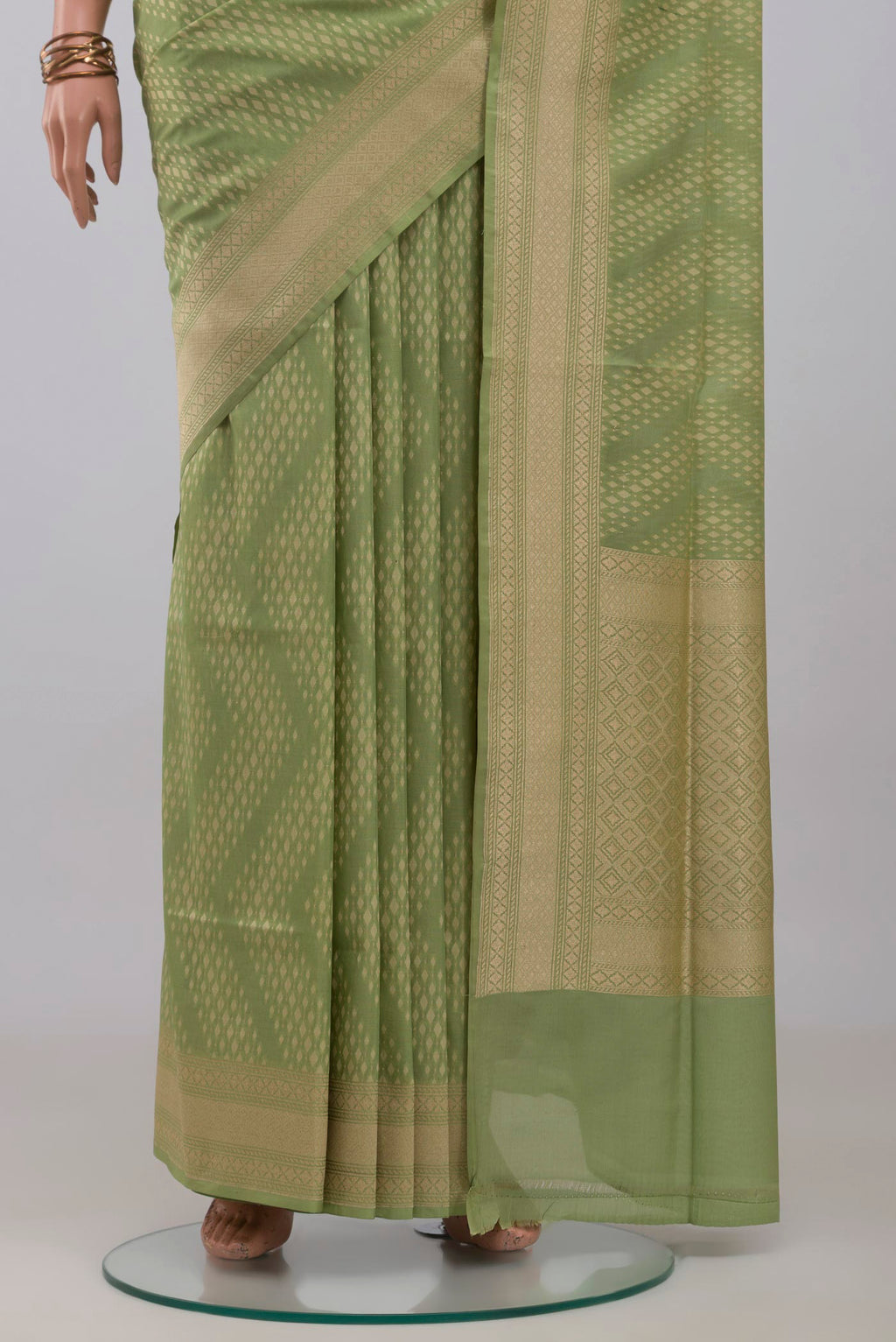 Pleats and pallu of Light Green Banarasi Silk Saree with Zari Butta on the body and Zari Border. 