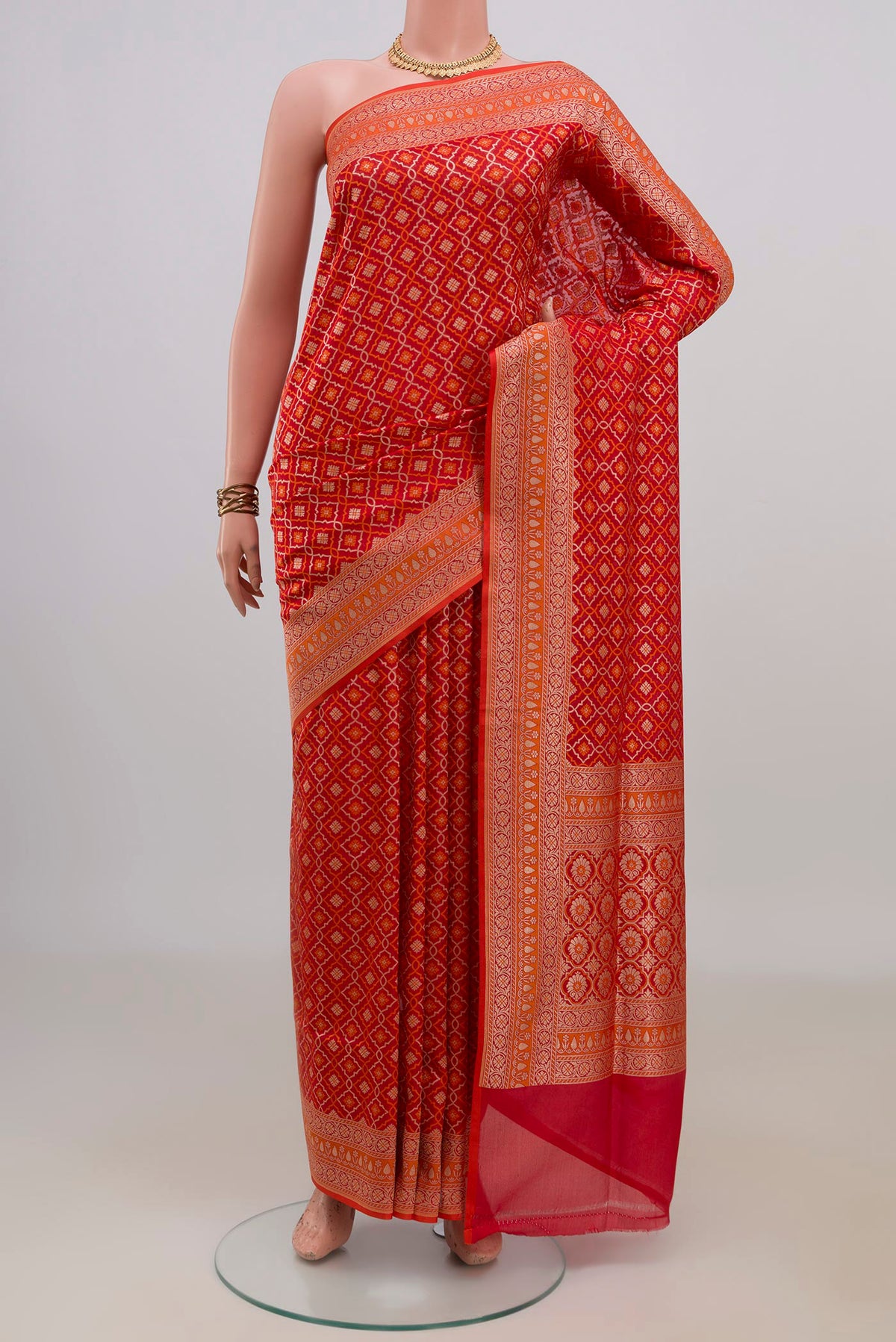 Pure Silk Red Banarasi Saree with Jacquard With Zari Butta on the body and Zari Border.  displayed on a mannequin